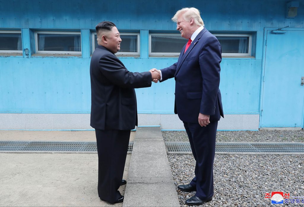 North Korea US Trump In this Sunday, June 30, 2019, photo provided by the North Korean government, North Korean leader Kim Jong Un, left, and U.S. President Donald Trump shake hands over the military demarcation line at the border village of Panmunjom in Demilitarized Zone. The content of this image is as provided and cannot be independently verified. Korean language watermark on image as provided by source reads: