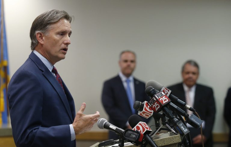 Oklahoma Attorney General Mike Hunter speaks to the media at a news conference following closing arguments in Oklahoma's ongoing opioid drug lawsuit against Johnson & Johnson Monday, July 15, 2019, in Norman, Okla. (Sue Ogrocki/AP Photo)