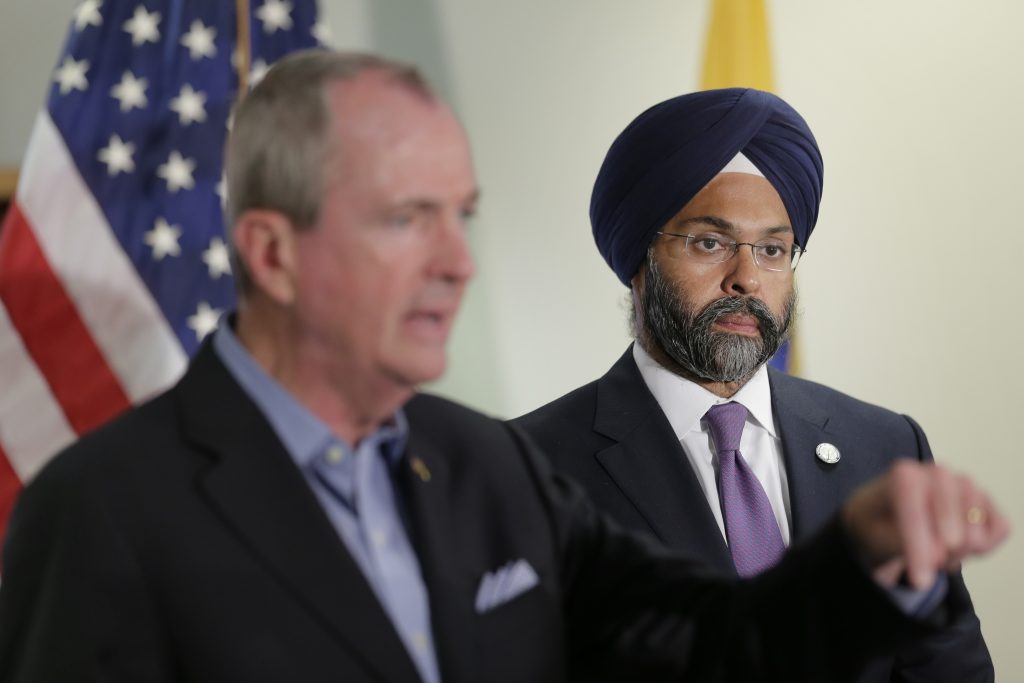 Phil Murphy, Gurbir Grewal While New Jersey Gov. Phil Murphy, (left), speaks, Attorney General Gurbir Grewal looks on after a bill signing ceremony in Berkeley Heights, N.J., Tuesday, July 16, 2019. Murphy has signed a measure aimed at making so-called smart guns available in the state. He also signed three other measures aimed at reining in gun violence. (Seth Wenig/AP Photo)