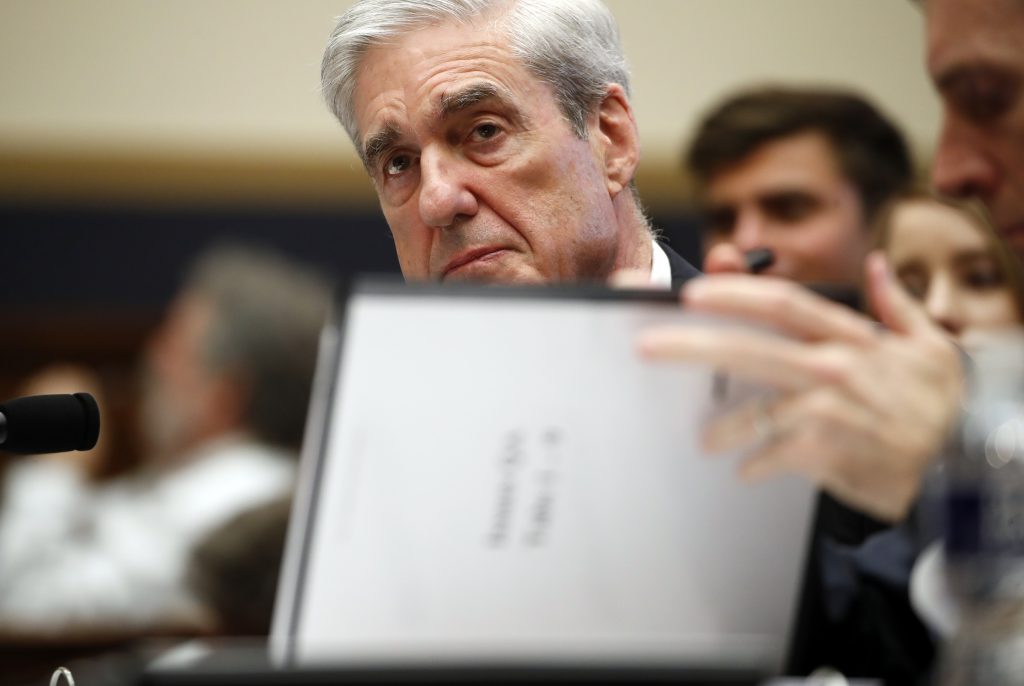 Robert Mueller Former special counsel Robert Mueller, checks pages in the report as he testifies before the House Judiciary Committee hearing on his report on Russian election interference, on Capitol Hill, Wednesday, July 24, 2019 in Washington. (Alex Brandon/AP Photo)