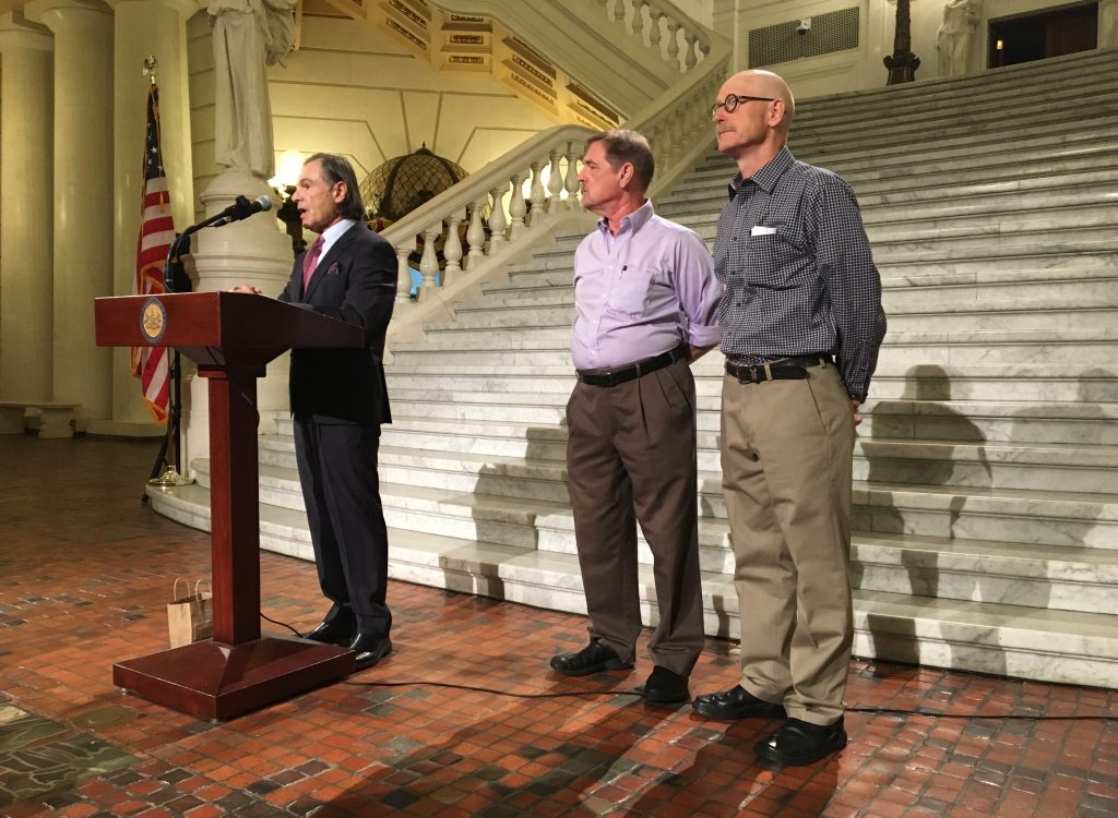 IMG_2443 Attorney Richard Serbin (left) and Don Asbee (right) announce the lawsuit at the state Capitol in Harrisburg. David Clohessy, with the Survivors Network of those Abused by Priests, is at center.