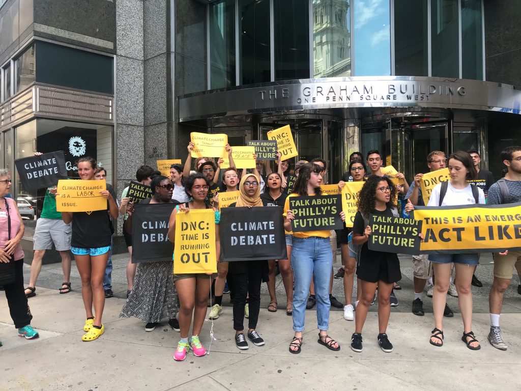 IMG_6365 Protesters gather attention outside the building that formerly housed offices of the Pa. Democratic Party. (Naomi Brauner/WHYY)