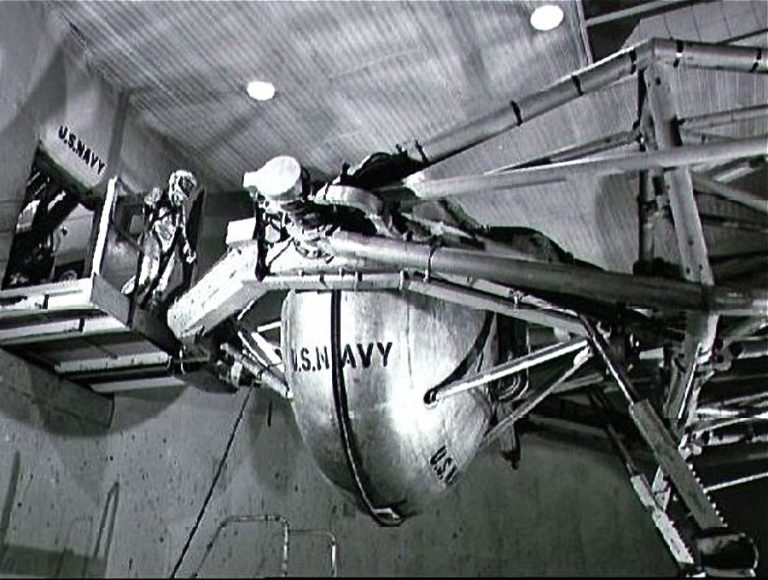 Astronaut Walter M. Schirra Jr. prepares to enter the gondola of a centrifuge which is used to test gravitational stress on astronauts training for space flight. Schirra became the pilot of the Mercury-Atlas 8 six-orbit space mission. Photo taken at Johnsville Naval Air Development Center, Warminster, Pennsylvania. Date Taken:1960-01-01 (NASA)
