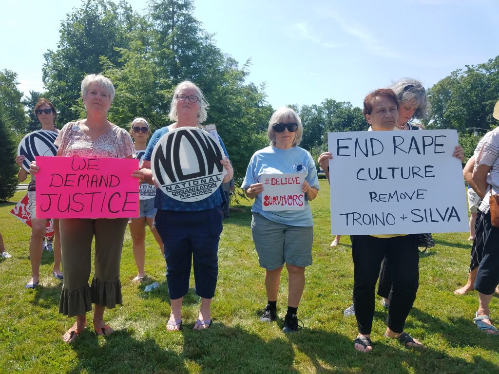 Judge2 From left, Carol Gay, Joni Brennan Catherine Hunt and JJ Mistretta hold signs at a protest in Freehold to demand the removal of Judges Troiano and Silva on July 11, 2019. (Nicholas Pugliese/WHYY)