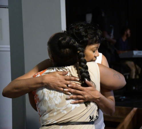 Truth Church Worship Center members embrace during Sunday service (Marissa Weekes Mason/The Philadelphia Tribune)