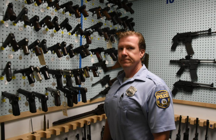 Philadelphia Police Officer Bob Mahan stands in the gun storage room. (Abdul Sulayman/The Philadelphia Tribune)