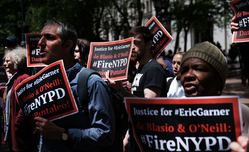 Protesters gathered outside of Police Headquarters in Manhattan in May to protest during the police disciplinary hearing for Officer Daniel Pantaleo, who was accused of using a chokehold that led to Eric Garner’s death in 2014. Protesters gathered outside of Police Headquarters in Manhattan in May to protest during the police disciplinary hearing for Officer Daniel Pantaleo, who was accused of using a chokehold that led to Eric Garner's death in 2014.