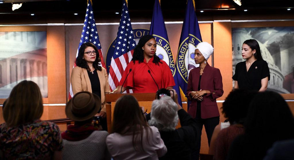 Rep. Ayanna Pressley, D-Mass., with Reps. Rashida Tlaib of Michigan (from left), Ilhan Omar of Minnesota and Alexandria Ocasio-Cortez of New York during a press conference on Monday to address racist remarks made by President Trump. Rep. Ayanna Pressley, D-Mass., with Reps. Rashida Tlaib of Michigan (from left), Ilhan Omar of Minnesota and Alexandria Ocasio-Cortez of New York during a press conference on Monday to address racist remarks made by President Trump. (Brendan Smialowski/AFP/Getty Images)