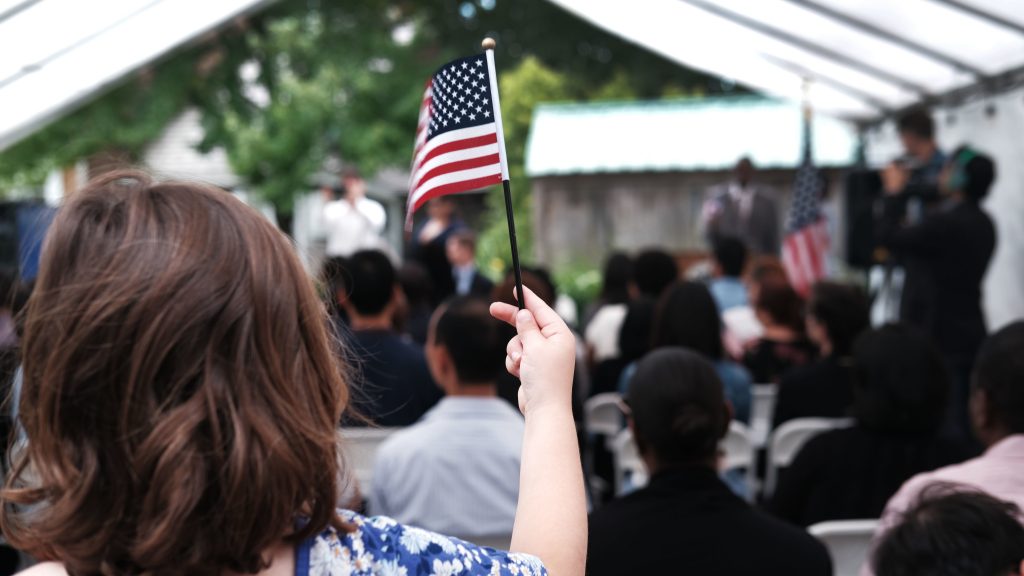 A child holds a U.S. flag at a naturalization ceremony at the Wyckoff House Museum in Brooklyn, on June 14, in New York City. A child holds a U.S. flag at a naturalization ceremony at the Wyckoff House Museum in Brooklyn, on June 14, in New York City. (Spencer Platt/Getty Images)