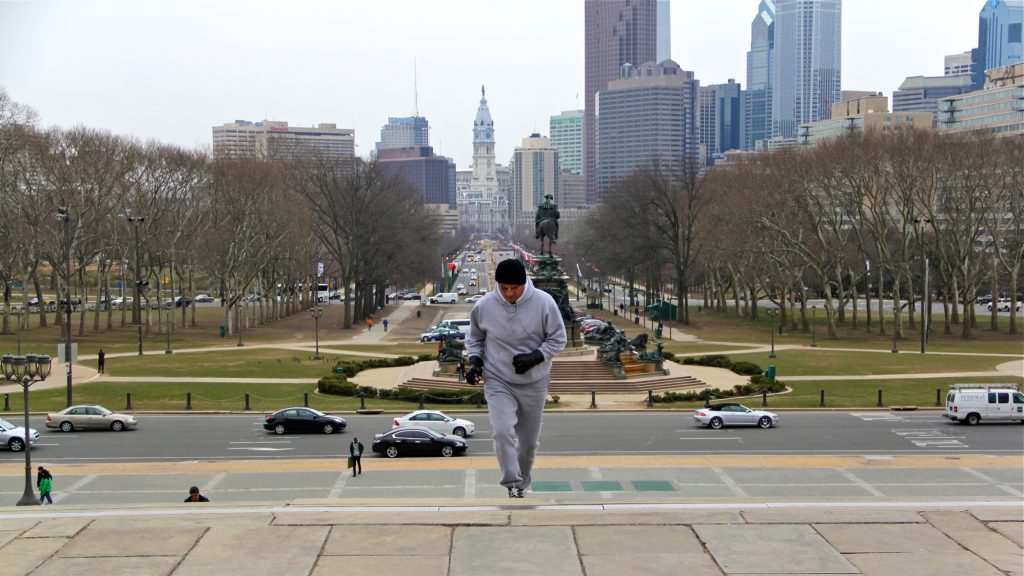 2014 03 25-e lee-john monforto-philadelphia art museum-rocky impersonator Rocky impersonator John Monforto runs up the steps of the Philadelphia Museum of Art. (Emma Lee/for NewsWorks)