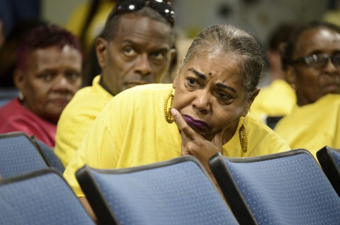 Fence-line neighbors and activists organized with Philly Thrive listen to a speaker from the community during the first meeting of the Philadelphia Energy Solutions refinery advisory group. (Bastiaan Slabbers for WHYY)