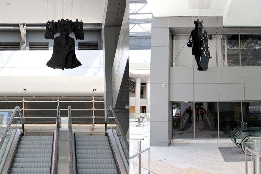 2019 08 12-e lee-fashion district philadelphia-percent for art bell penn A hanging sculpture of the Liberty Bell by perceptual artist Michael Murphy becomes William Penn when viewed from a different angle. (Emma Lee/WHYY)