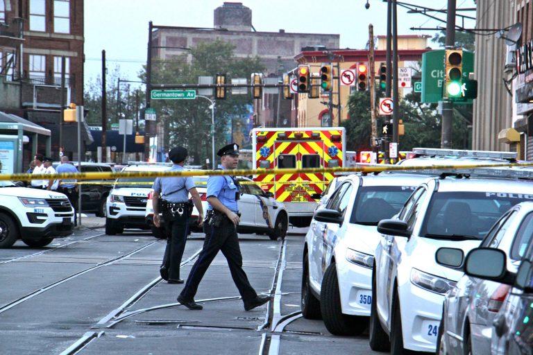 Police cordon off a large area aroung Broad and Erie streets after a gunman opened fire and held police at bay for seven hours. (Emma Lee/WHYY)