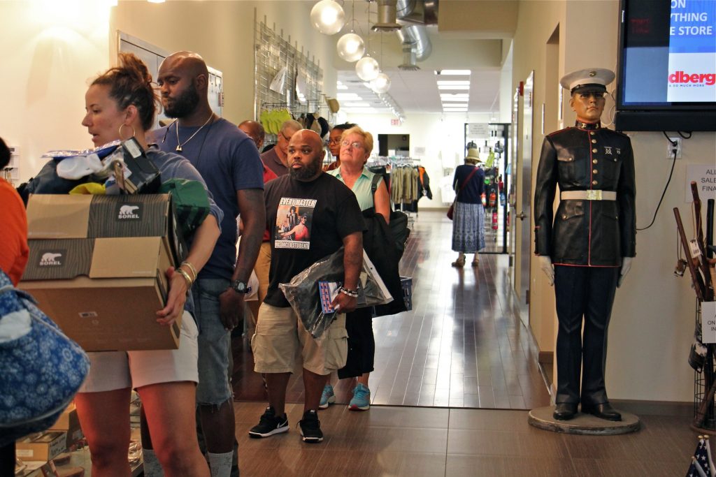 2019 08 21-e lee-philadelphia i goldberg-store closing Shoppers line up at check out at I. Goldberg, which will close on Friday after 100 years in Philadelphia. (Emma Lee/WHYY)