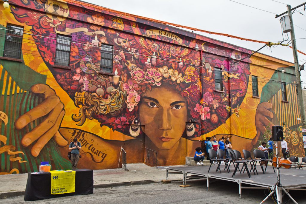 2019 08 27 kpaynter chilean mural north philadelphia Artists Ian Pierce and Betsy Casañas created “Sanctuary City, Sanctuary Neighborhood,” a mural highlighting immigration issues in society located at 5ht and Huntingdon Streets in North Philadelphia. (Kimberly Paynter/WHYY)