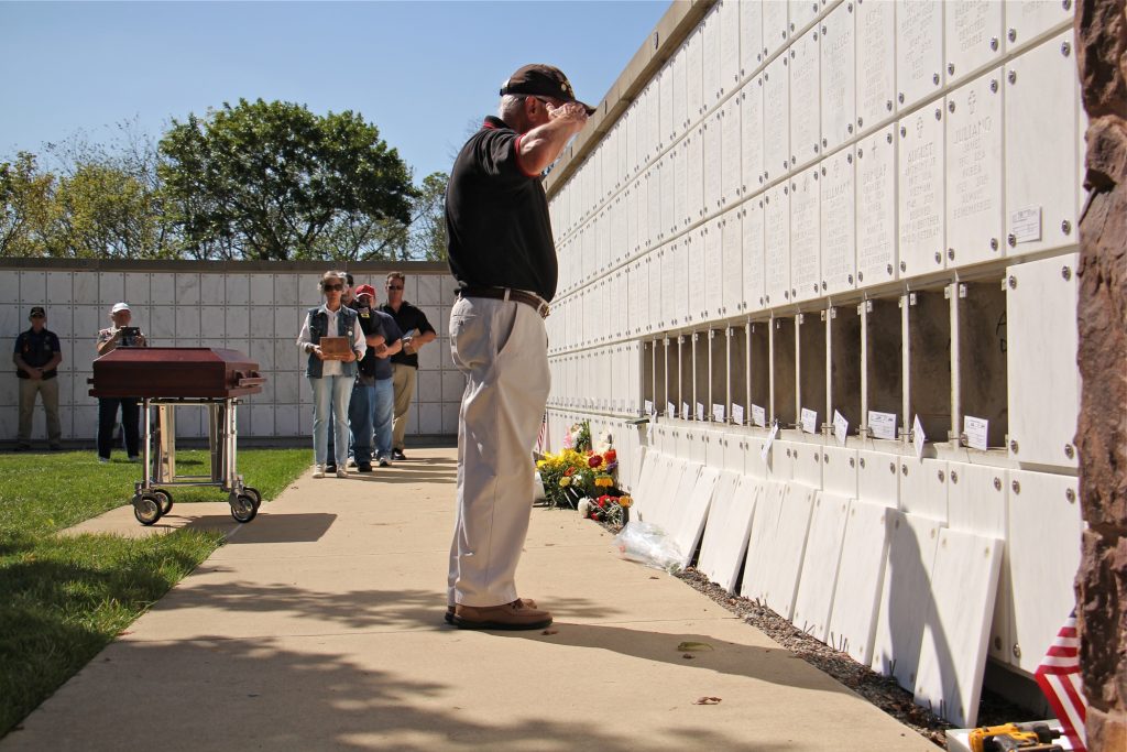 2019 08 29-e lee-al duncan-newtown washington crossing national cemetery-unclaimed remains burial Al Duncan of Malvern, a member of the Chester County Vietnam Veterans of America, salutes after placing the remains of Eugene Gorski in a niche at Washington Crossing National Cemetery. (Emma Lee/WHYY)