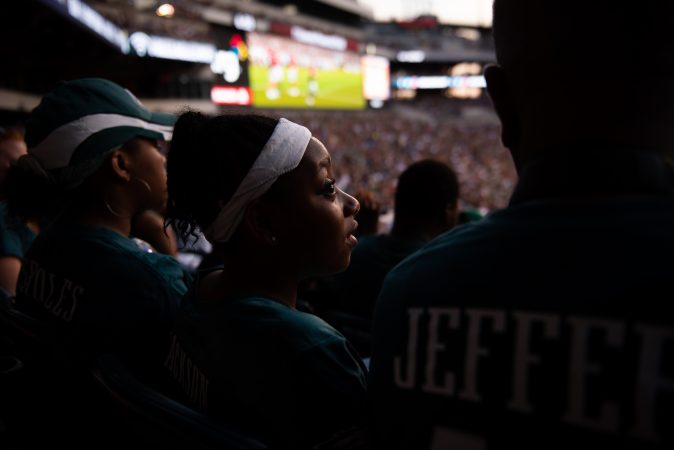 Serenity Faulkner watches the Philadephia Eagles practice at Lincoln Financial Field on Sunday, August 4, 2019. (Kriston Jae Bethel for WHYY)