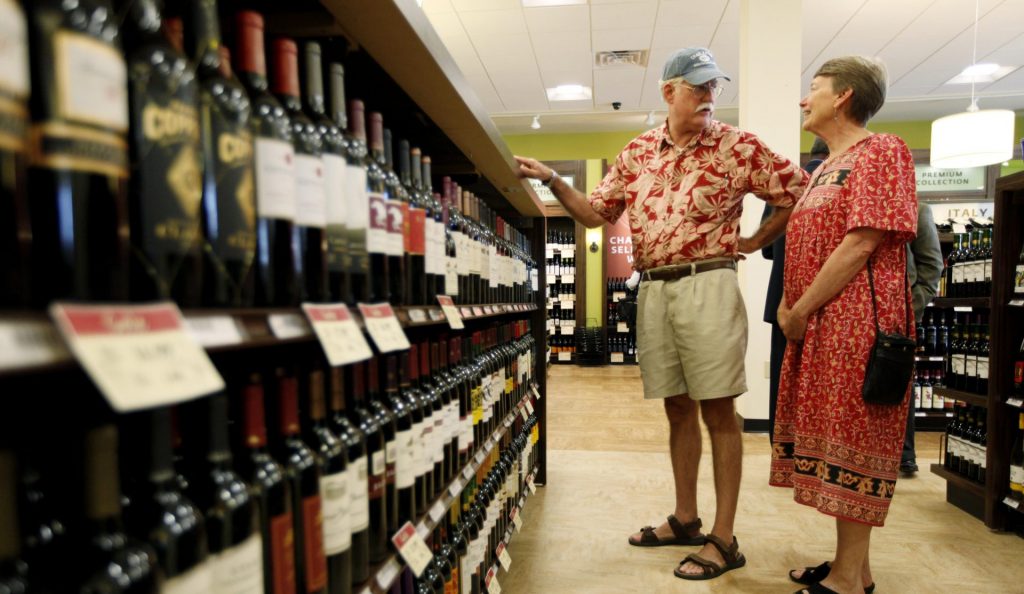 In this Thursday, July 22, 2010 file photo, Hugh and Karen Hoffman of Wycombe, Pa. shop at a state wine and liquor store in New Hope, Pa. (Matt Rourke/AP Photo)