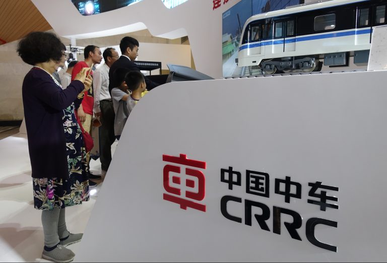 People visit the stand of CRRC (China Railway Rolling Stock Corp) during an expo in Shanghai, China, 14 June 2018. (Imaginechina via AP Images)