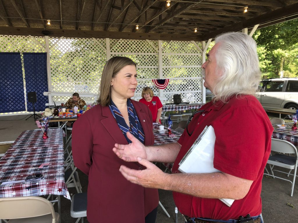 Impeachment Town Halls Rep. Elissa Slotkin, D-Mich., talks with a constituent after a veterans event on Friday, Aug. 2, 2019, at the Ingham County Fair in Mason, Mich. Slotkin, who flipped the 8th Congressional District by defeating a Republican incumbent in 2018, has not backed an impeachment inquiry of President Donald Trump. (David Eggert/AP Photo)