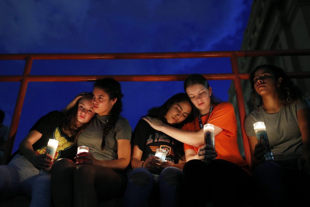 AP_19216113417273-1920×1285 From left, Melody Stout, Hannah Payan, Aaliyah Alba, Sherie Gramlich and Laura Barrios comfort each other during a vigil for victims of the shooting Saturday, Aug. 3, 2019, in El Paso, Texas. A young gunman opened fire in an El Paso, Texas, shopping area during the busy back-to-school season, leaving multiple people dead and more than two dozen injured. (John Locher/AP Photo)