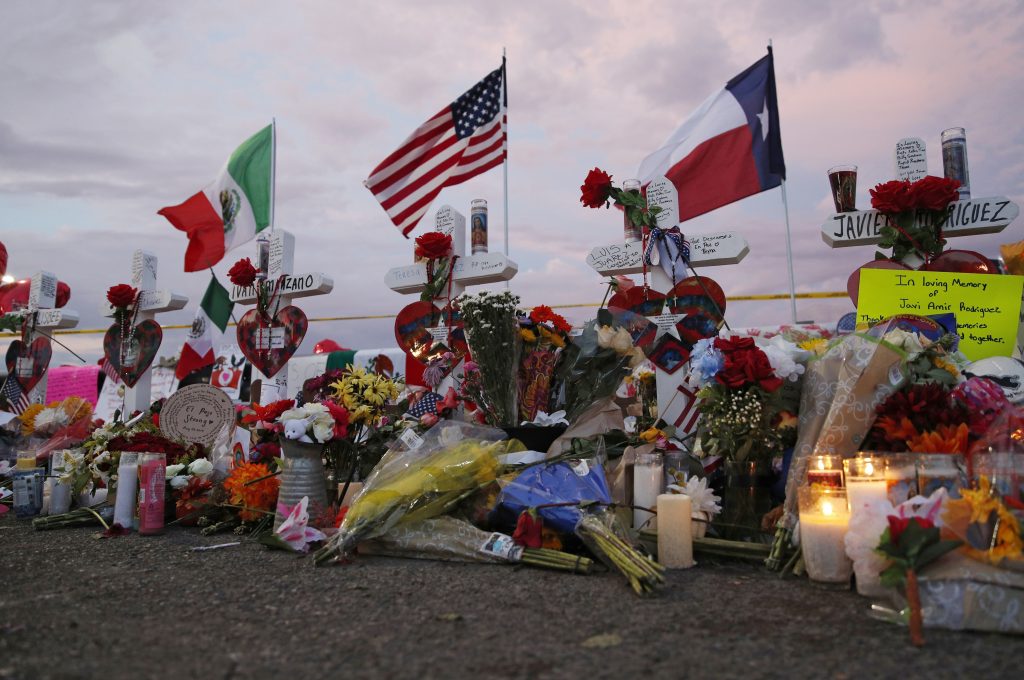 Texas Mall Shooting Flags fly over crosses at a makeshift memorial near the scene of a mass shooting at a shopping complex Tuesday, Aug. 6, 2019, in El Paso, Texas. (AP Photo/John Locher)