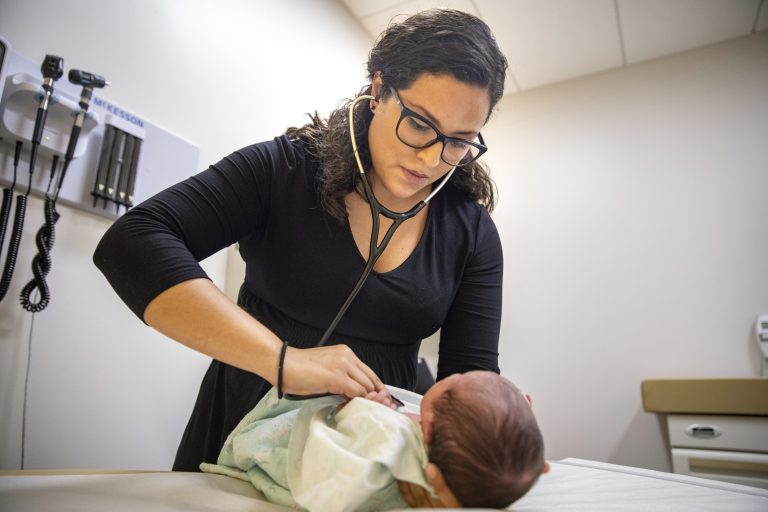 Doctors and public health experts warn of poor health outcomes and rising costs they say will come from sweeping changes that would deny green cards to many immigrants who use Medicaid, as well as food stamps and other forms of public assistance. Saavedra is convinced that if new Trump administration criteria were in effect for her parents three decades ago, she wouldn’t have become a pediatrician. (Amr Alfiky/AP Photo)