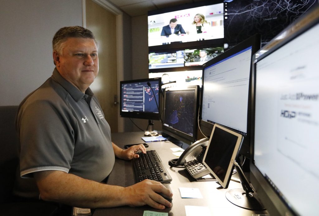 Surveillance Scary Smart Cameras In this July 30, 2019, photo, Paul Hildreth, emergency operations coordinator for the Fulton County School District, works in the emergency operations center at the Fulton County School District Administration Center in Atlanta. Artificial Intelligence is transforming surveillance cameras from passive sentries into active observers that can immediately spot a gunman, alert retailers when someone is shoplifting and help police quickly find suspects. (Cody Jackson/AP Photo)
