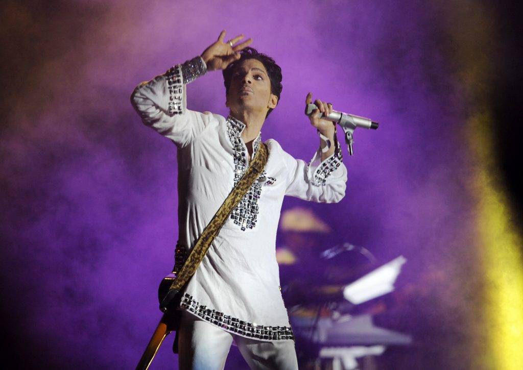 Woodstock Contemporary Festivals In this April 26, 2008 file photo, Prince performs during his headlining set on the second day of the Coachella Valley Music and Arts Festival in Indio, Calif. (Chris Pizzello/AP Photo)