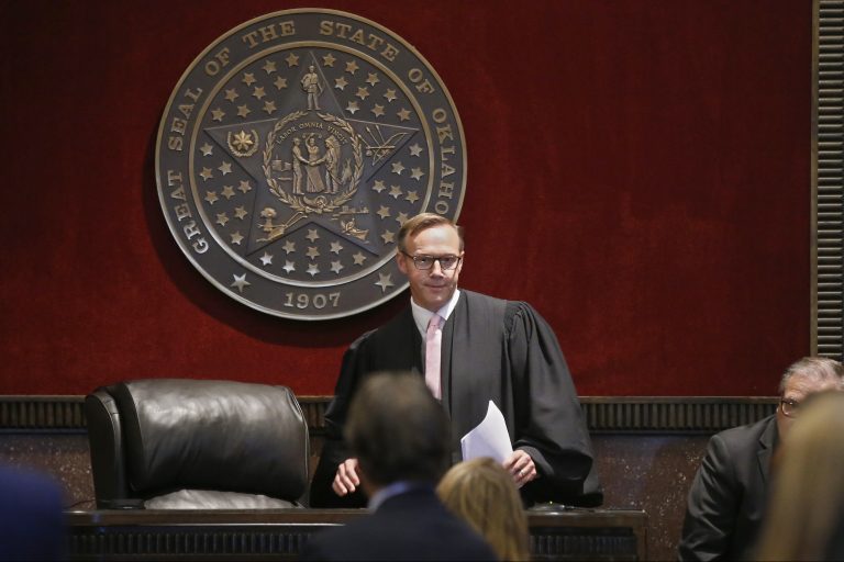 Judge Thad Balkman arrives to give his decision in the Opioid Lawsuit in Norman, Okla., Monday, Aug. 26, 2019. Balkman found Johnson & Johnson and its subsidiaries helped fuel the state's opioid drug crisis and ordered the consumer products giant to pay $572 million to help abate the problem in the coming years. (AP Photo/Sue Ogrocki, Pool)
