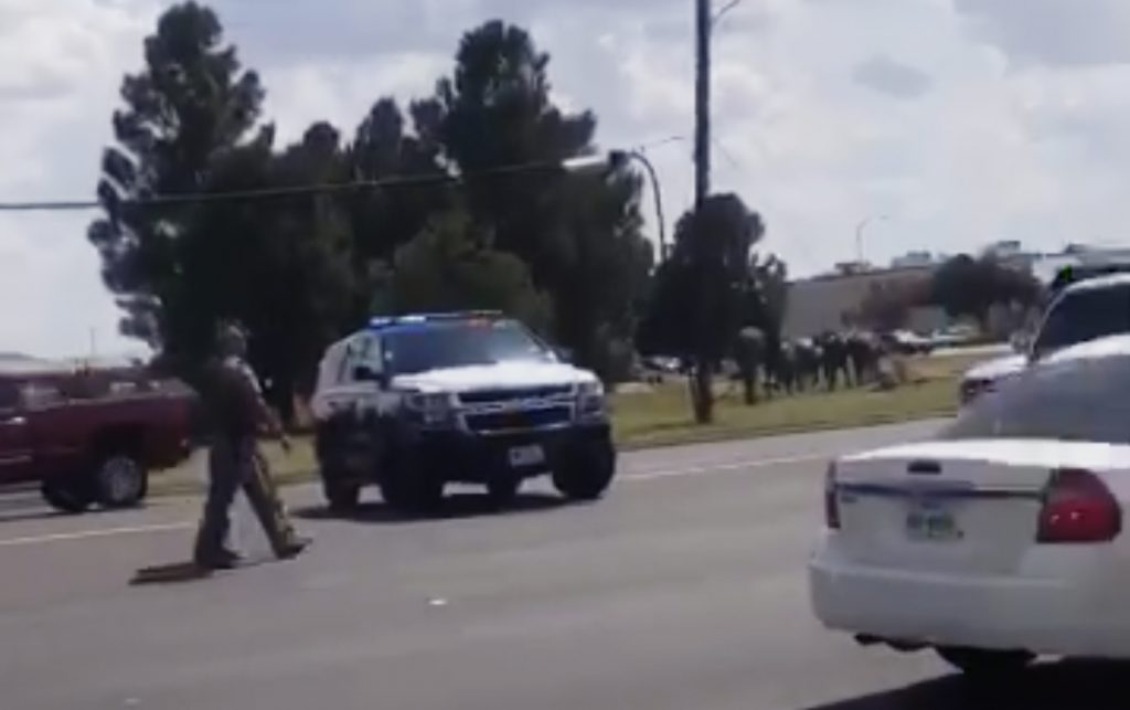Shootings Texas In this image made from video provided by Dustin Fawcett, police officers guard on a street in Odessa, Texas, Saturday, Aug. 31, 2019. Police said there are