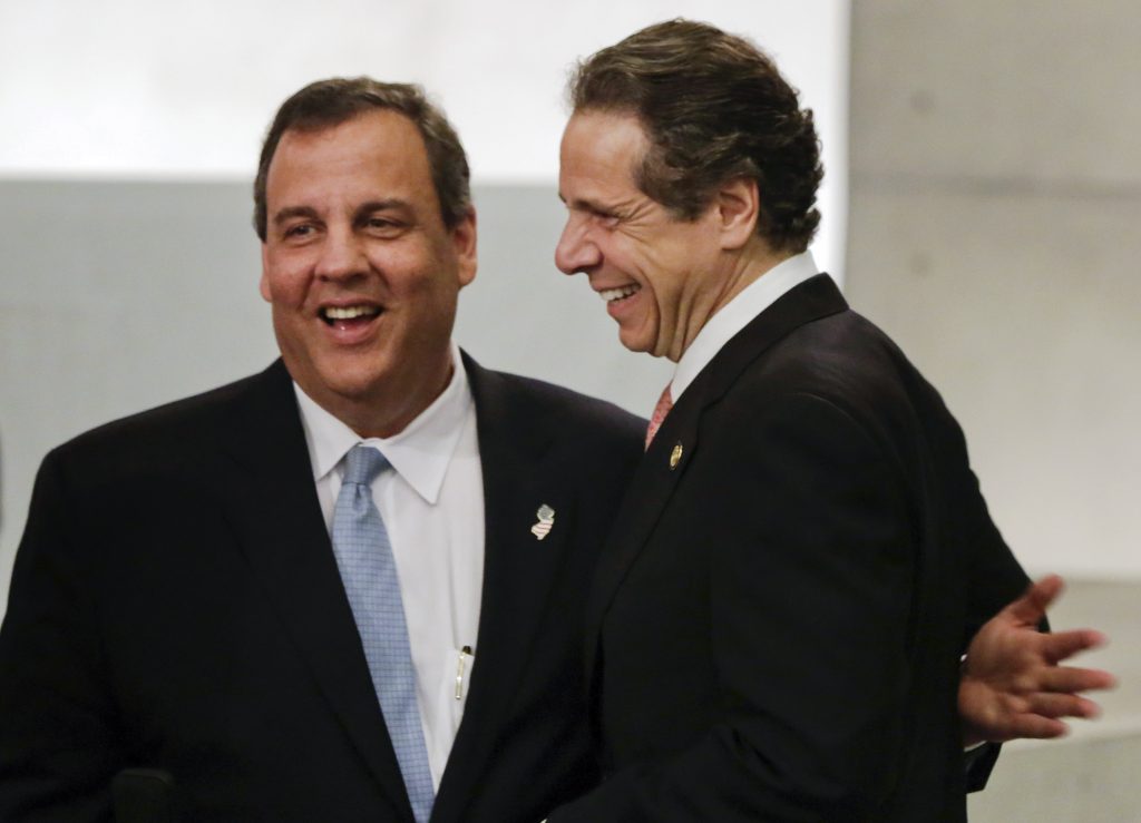 New Jersey Gov. Chris Christie, left, and New York Gov. Andrew Cuomo meet during the dedication ceremony in Foundation Hall, of the National September 11 Memorial Museum, in New York, Thursday, May 15, 2014. (AP Photo/Richard Drew, Pool)