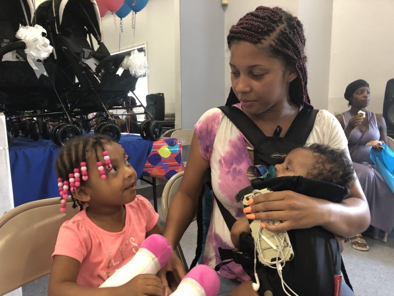 Saadya Elliott Dixon attended the Harper’s Heart event at Kingswood with her daughters, Sariyah, who is 3 years old, and Samiyah. (Cris Barrish/WHYY)
