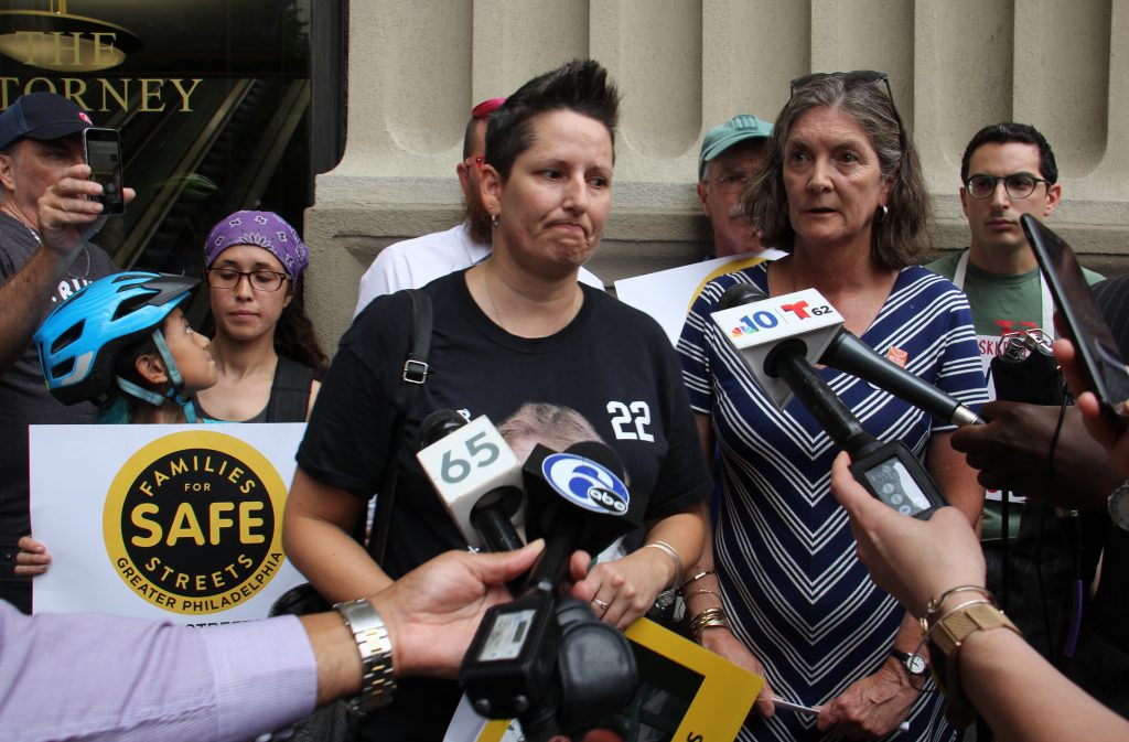 Jill Fredricks Brown urges prosecutors to continue to pursue charges against the driver who killed her niece, Emily Fredricks, as she rode her bicycle in the bike lane on Spruce Street. (Emma Lee/WHYY)