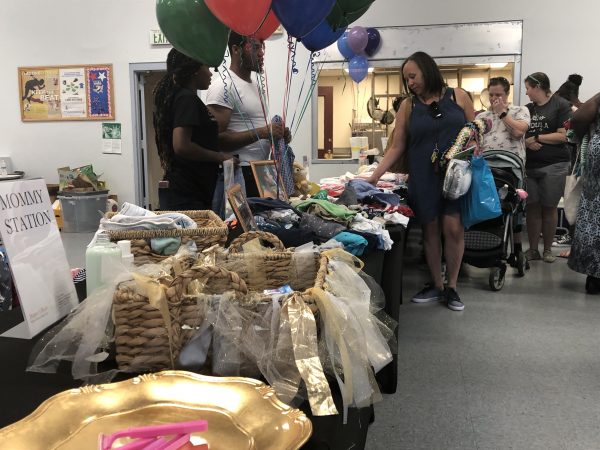 The Harper’s Heart giveaway in August at the Kingswood Community Center in Northeast Wilmington drew dozens of expectant mothers and women with newborns, along with their families. (Cris Barrish/WHYY)