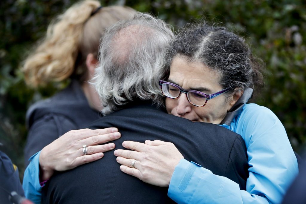 Pittsburgh_synagogue_shooting-1920×1280 People embrace along the street in the Squirrel Hill neighborhood of Pittsburgh where a shooter opened fire during services at the Tree of Life Synagogue on Saturday, Oct. 27, 2018. (Keith Srakocic/AP Photo)
