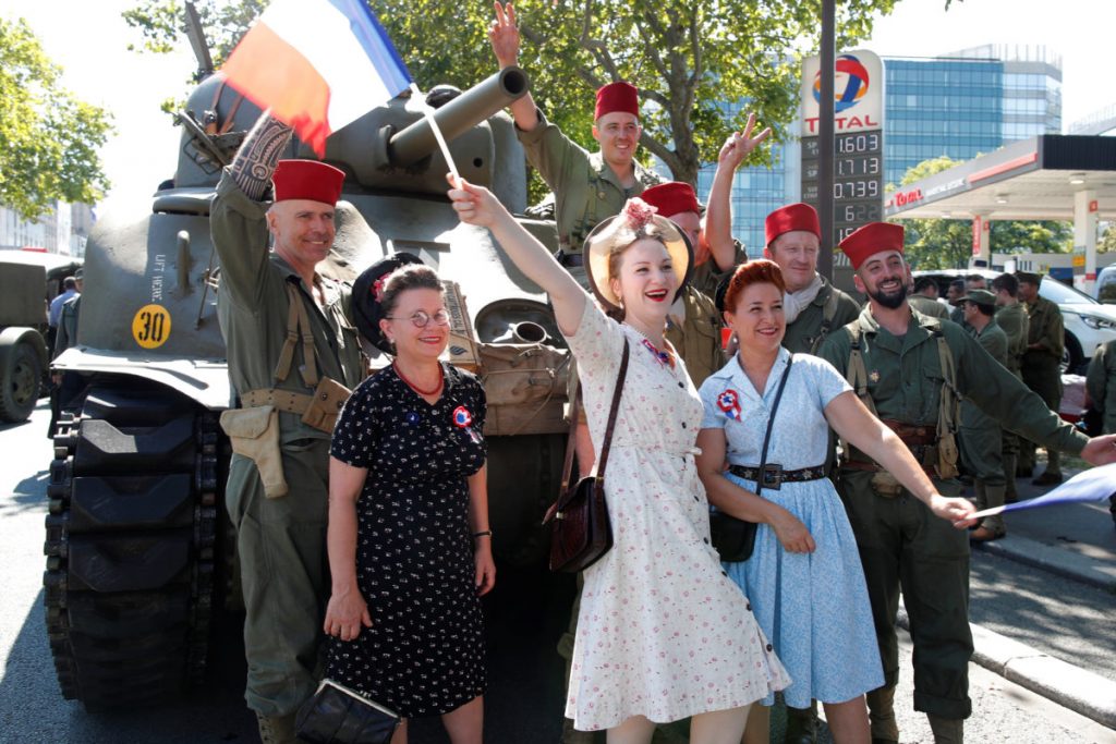 Vintage military vehicles and reenactors take part in a reenactment of the liberation of Paris from German occupation to celebrate its 75th anniversary Vintage military vehicles and reenactors take part in a reenactment of the liberation of Paris from German occupation to celebrate its 75th anniversary, in Paris, France, August 25, 2019. REUTERS/Charles Platiau - RC18C82A7B40