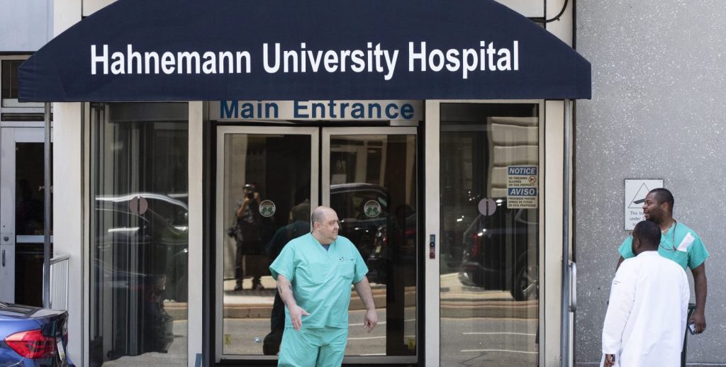 SLE32H37HZGXXMLJCCQEE23KDU-e1564588805588-1920×744 A person exits Hahnemann University Hospital in Philadelphia, Wednesday, June 26, 2019. (Matt Rourke/AP Photo)