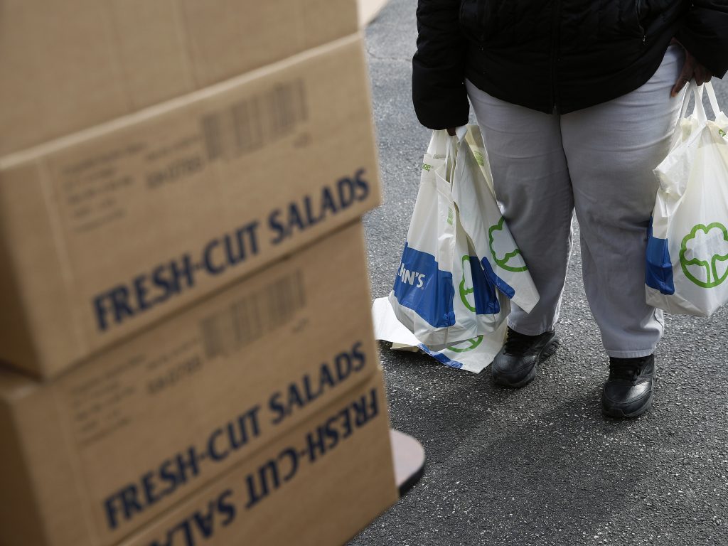 An FDA contract worker collects food and supplies from a food pantry in Baltimore. In the face of a Trump administration proposal that could cause 3 million people to lose federal food assistance, mayors from 70 cities are pushing back. An FDA contract worker collects food and supplies from a food pantry in Baltimore. In the face of a Trump administration proposal that could cause 3 million people to lose federal food assistance, mayors from 70 cities are pushing back. (Patrick Semansky/AP Photo)