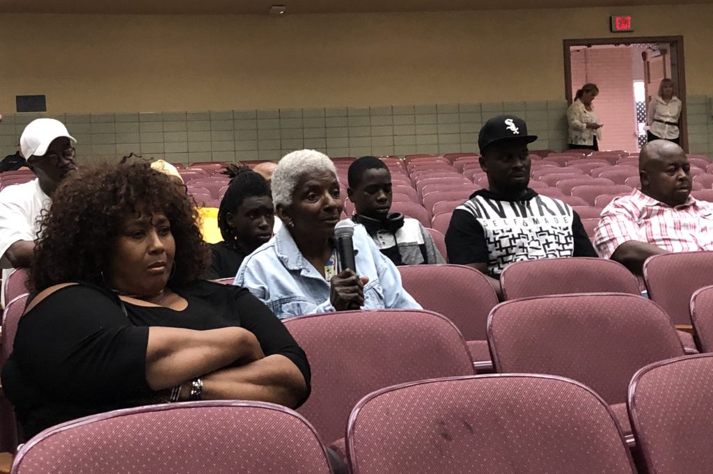 croda meeting A woman who lives near the Croda chemical plant questions company and state officials during a meeting about November’s toxic release and steps being taken before the plant can resume making ethylene oxide. (Cris Barrish/WHYY)