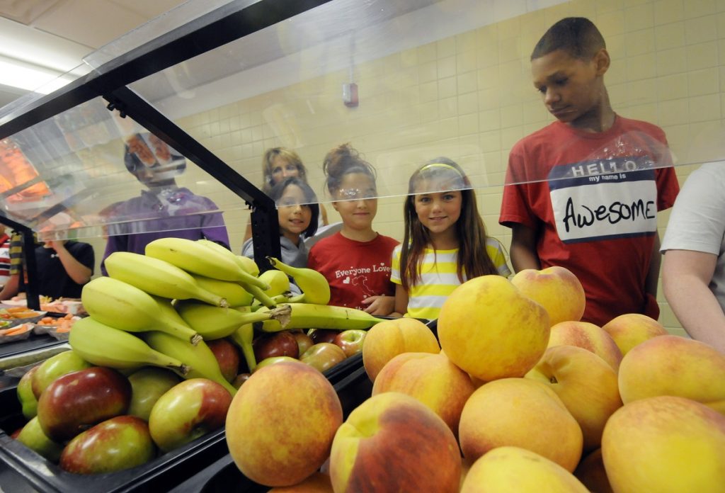 Students Students select food items from the lunch line of the cafeteria at Draper Middle School in Rotterdam, N.Y. (AP Photo/Hans Pennink)