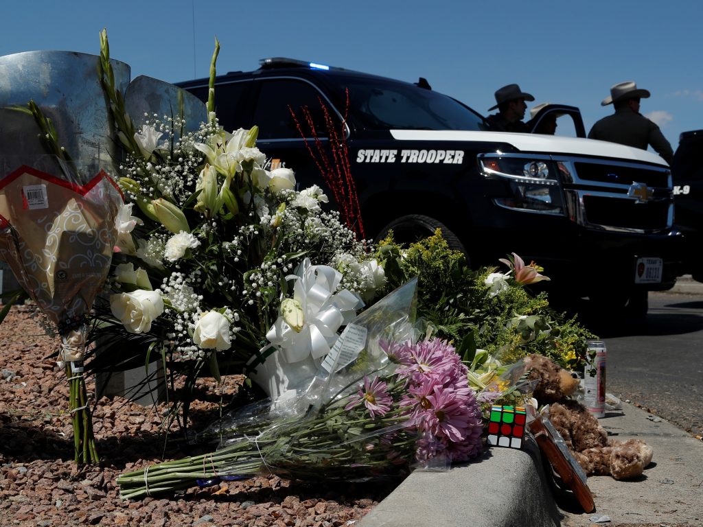 Flowers adorn a makeshift memorial near the scene of a mass shooting at a shopping complex Sunday in El Paso, Texas. Flowers adorn a makeshift memorial near the scene of a mass shooting at a shopping complex Sunday in El Paso, Texas. (John Locher/AP Photo)