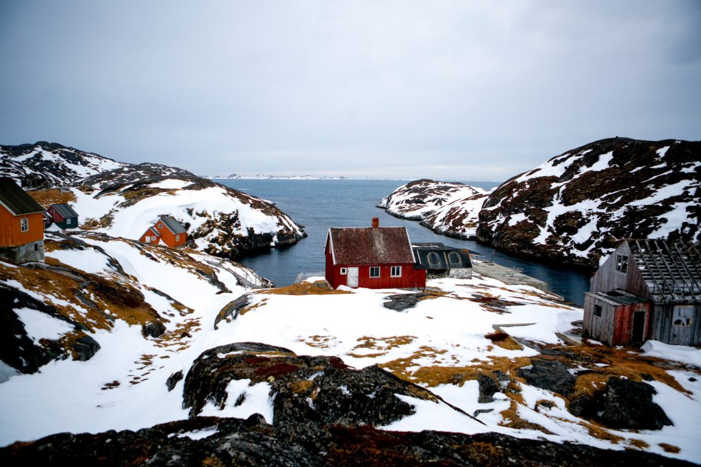 A present-day view of the harbor in Kangeq, which was abandoned by the Danish government. The capital of Greenland is also its largest city — Nuuk has a population of about 18,000. Aqqusinersuaq Road (above) leads into the city center. (John W. Poole/NPR)