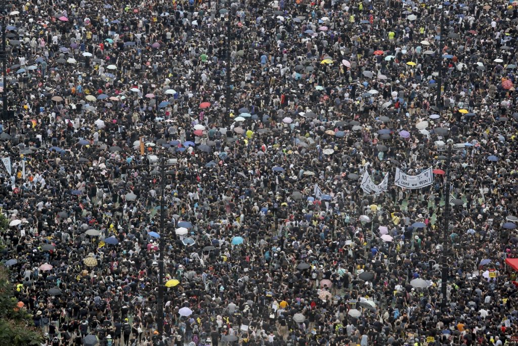 APTOPIX Hong Kong Protests Protesters gather on Victoria Park in Hong Kong on Sunday, Aug. 18, 2019. Thousands of people streamed into a park in central Hong Kong on Sunday for what organizers hope will be a peaceful demonstration for democracy in the semi-autonomous Chinese territory. (AP Photo/Kin Cheung)