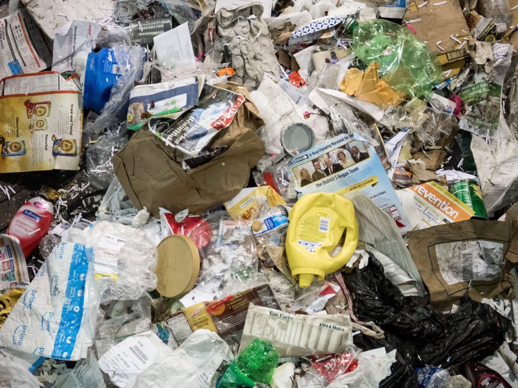 Trash sent for recycling moves along a conveyor belt to be sorted at Waste Management’s material recovery facility in Elkridge, Md. In 2018, China announced it would no longer buy most plastic waste from places like the United States. Trash sent for recycling moves along a conveyor belt to be sorted at Waste Management's material recovery facility in Elkridge, Md. In 2018, China announced it would no longer buy most plastic waste from places like the United States. (Saul Loeb/AFP/Getty Images)