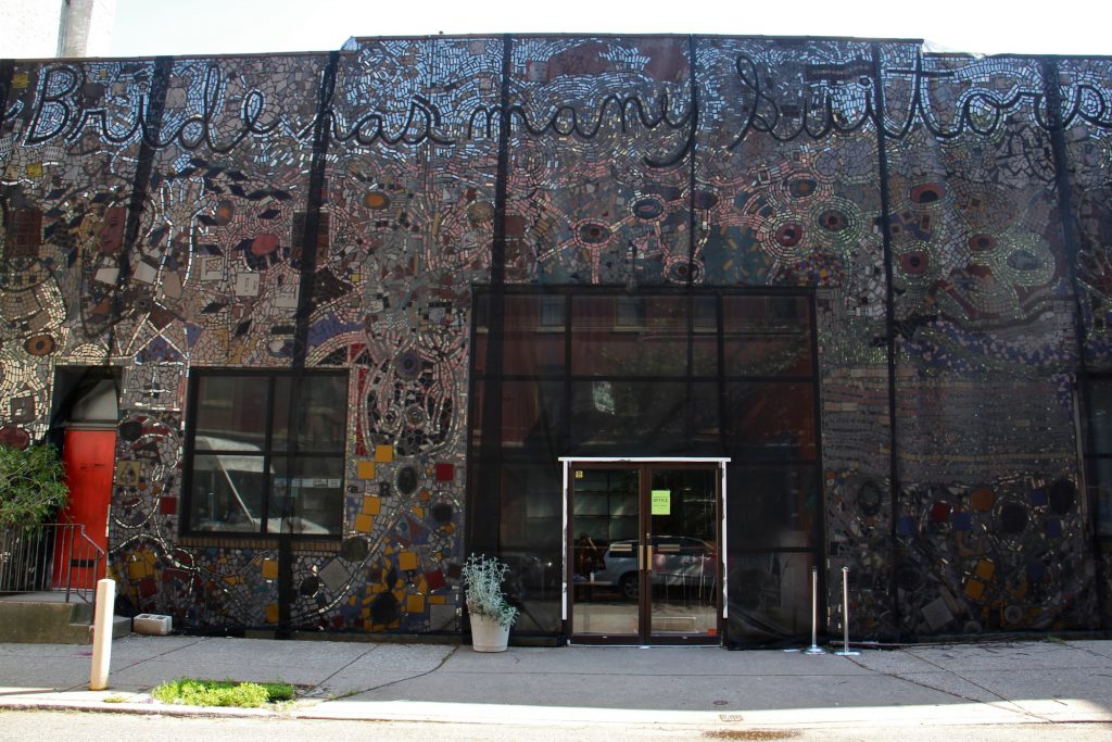 2019 05 15-e lee-philadelphia painted bride-isaiah zagar mural falling The Painted Bride Art Center is draped in black mesh since it was discovered that the Isaiah Zagar mural that covers it is separating from its walls. (Emma Lee/WHYY)