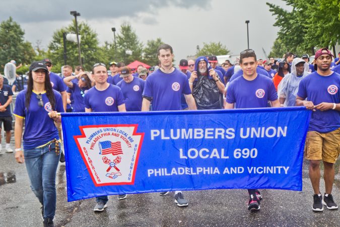 Members of the Plumbers Union march in Philadelphia’s 2019 Labor Day Parade. (Kimberly Paynter/WHYY)