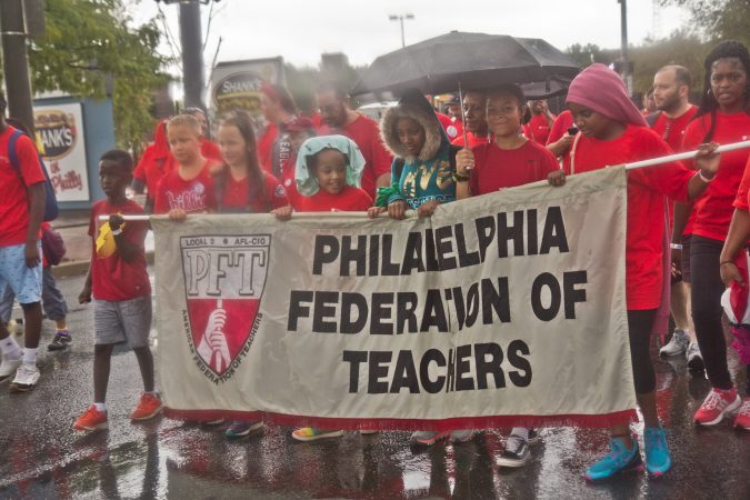 Family members join PFT union workers during the 2019 Labor Day Parade. (Kimberly Paynter/WHYY)
