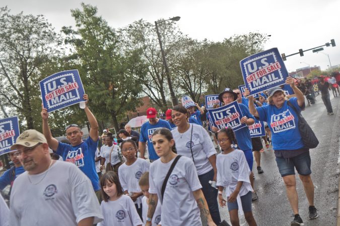 The National Association of Letter Carriers marches in the 2019 Philadelphia Labor Day Parade. (Kimberly Paynter/WHYY)