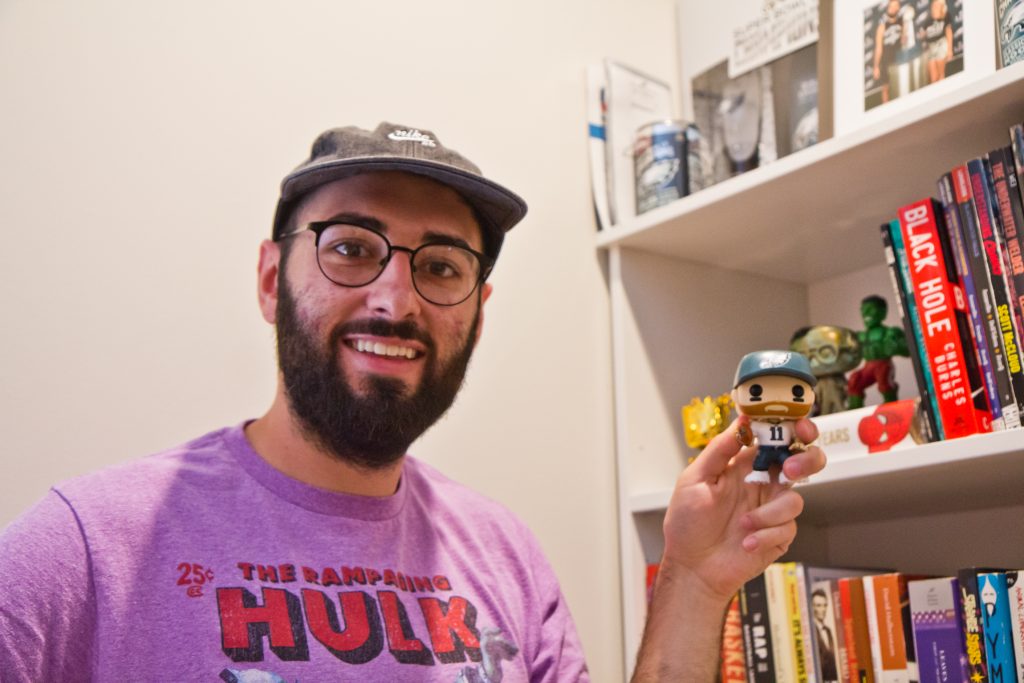 2019 09 11 kpaynter shamus clancy Shamus Clancy, Philadelphia writer and sports super fan, shows off his Carson Wentz bobble head toy at his apartment in South Philly. (Kimberly Paynter/WHYY)